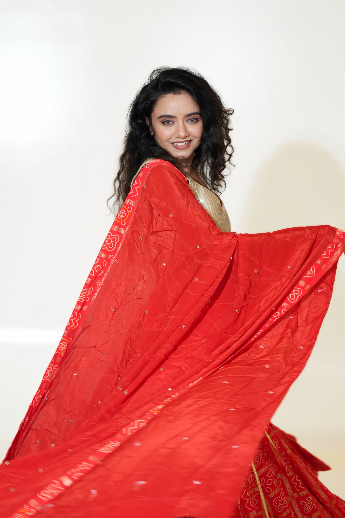 Red Printed Lehenga with Gold-Toned Blouse