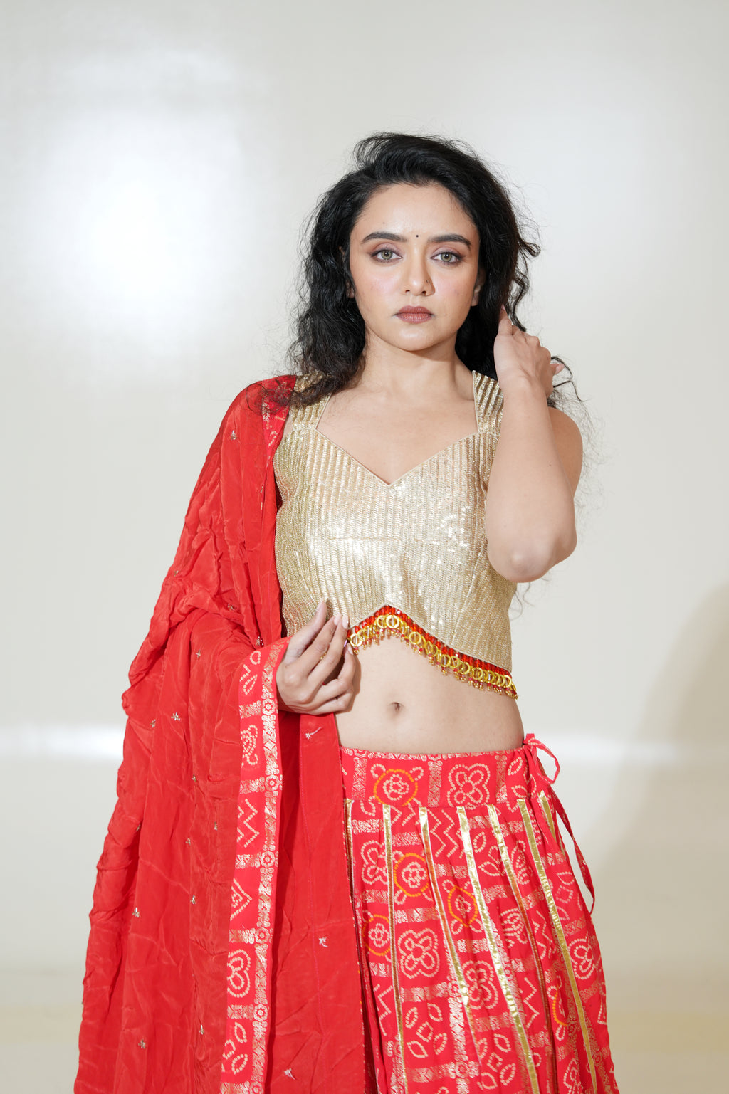 Red Printed Lehenga with Gold-Toned Blouse