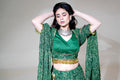 Emerald Green Patterned Lehenga with Gold-Toned Trim